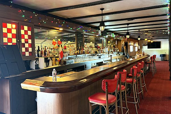 Bar and seating area with stained glass accents