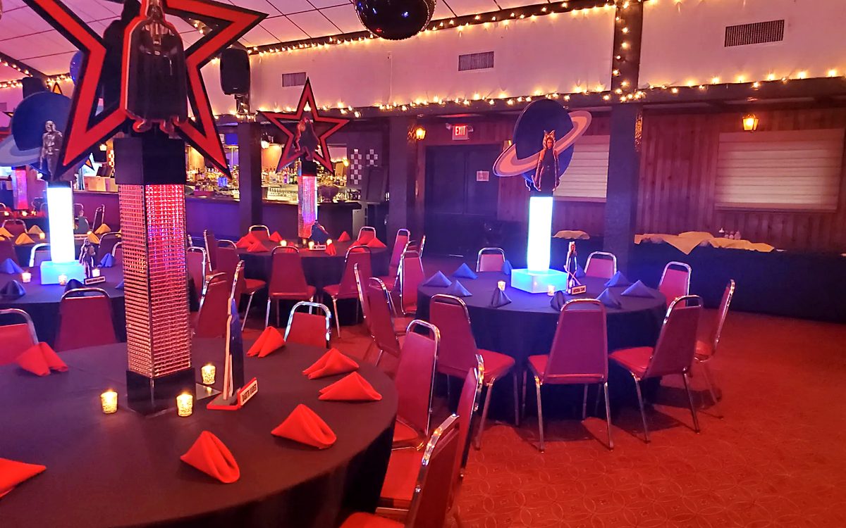 Themed party setup with custom decor and LED centerpieces